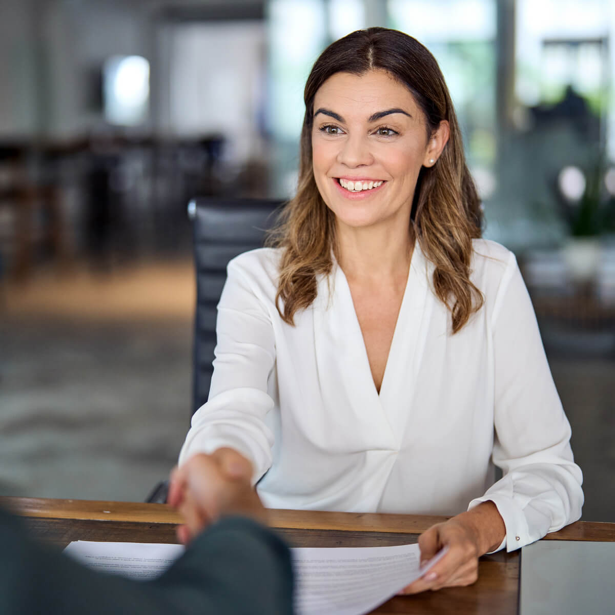 female-insurance-agent-shaking-hands Female Insurance Agent Shaking Hands