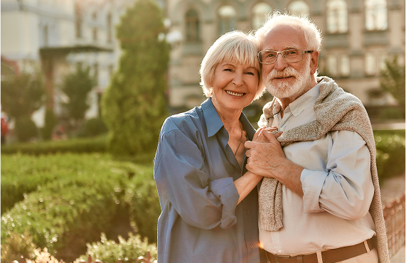 Medicare Happy old couple holding each other